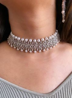 Luxury Tilla Choker For Gift, Luxury White Kundan Necklace For Wedding, Dazzling Diamond White Choker Necklace, Dazzling Diamond Choker Necklace, Elegant Festive Pearl Drop Choker, Glamorous Round Pearl Jewelry, Hand Set Choker Necklace For Receptions, Wedding Diamond Choker Necklace, Hand-set Choker Necklace For Receptions