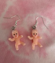 These baby dangle earrings never fail to get noticed! Each baby is approximately 2.5cm long. Each earring drop is made from 925 sterling silver, so lead and nickel free and safe to wear.  As this is a handmade product, slight colour and size variations may occur.  Rubber earring backs will be provided with each pair. Your earrings will be dispatched within 1-2 days and sent via Royal Mail 1st Class.  Due to hygiene reasons, returns will be accepted but only if the product is faulty. Please get in touch if you have any questions or particular requirements and I'll do my best to help. Any feedback is welcome to help grow my small business.  *New products added weekly, please follow the store and check back regularly to see our product line grow* Instagram @fill.ya.holes Playful Personalized Dangle Earrings, Cute Drop Earrings For Birthday, Cute Dangle Earrings For Birthday, Kawaii Dangle Jewelry For Party, Doll Earrings, King Cake Baby, Weird Jewelry, Funny Earrings, Ugly Dolls