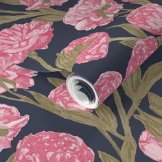 a wallpaper with pink flowers and green leaves on it's dark blue background