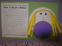 a purple ball and some writing paper on a wall