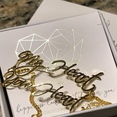 two birthday cards in a gift box on a marble counter top with the words happy birthday