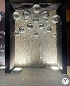 an open door with silver balls hanging from it