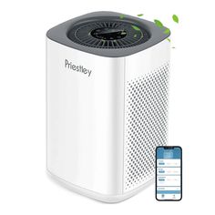 an air purificater next to a cell phone with the app on it