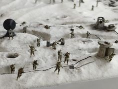 small toy soldiers are standing in the snow