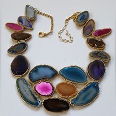 Nwot An Elegant Array Of Reconstructed Multicolor Agate Stones Creates A Statement Of Regal Beauty With This Stunning Necklace. Handmade By Artisans, This Bib Necklace Is A Unique Accent To Any Wardrobe. Please Note: The Handcrafted Nature Of This Product Will Produce Minor Imperfections Constant With Handmade Natural/Artisan Products. Perfect For Gift Giving To Someone Special Or Keep For Yourself! About This Item * Stone: Reconstructed Sliced Genuine Agate * Trim: Chainlink In Gold Finish Arou Multicolor Gemstone Pendant Necklace, Adjustable Multicolor Agate Necklace, Multicolor Agate Necklace For Gift, Multicolor Natural Stones Necklace For Party, Multicolor Gemstone Necklace For Party, Unique Multicolor Gemstone Accent Necklaces, Unique Multicolor Necklaces With Gemstone Accents, Unique Multicolor Gemstone Necklaces, Multicolor Jeweled Beaded Necklaces As Gift