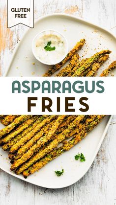 grilled asparagus fries on a white platter with ranch dip and parsley