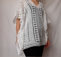 Beach lace tunic, white color, made of mercerized cotton. The pattern gives a nice ethnic look. The width is adjustable, as there are two strings on both sides (Romanian cord made also by hand) of the same thread. It can be worn as a short caftan, a beach dress, or swimsuit cover up. The cotton and the lace pattern give a pleasant cooling effect, helping to enjoy the summer days.  Made in smoke free, pet friendly environment.  Length: 27'' or 68 cm Width: 31'' or 78 cm Neck opening depth: 7.5'' White V-neck Crochet Dress For Beach, White Crochet Lace Top For Beach Cover-up, White Crochet Bohemian Cover-up, White Summer Tunic Kaftan, White Tunic Beach Dress, White Tunic Kaftan For Beach Season, White Tunic Kaftan For Summer, White Crochet Lace Beach Dress For Spring, Bohemian White Crochet Dress For Beach Season