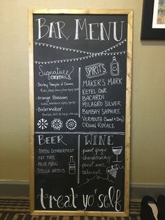 a chalkboard menu is displayed in front of a pair of black slip - ons