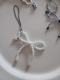 a white plate topped with beads and charms