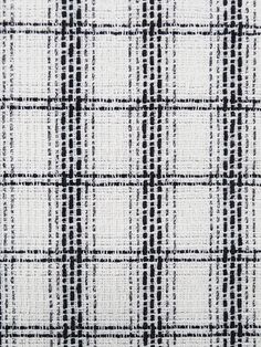 black and white checkered fabric textured with small squares on the top, as if it were woven or wovened together