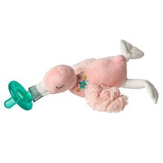 a pink stuffed animal laying on top of a pacifier