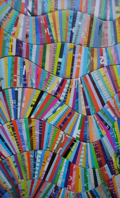 colorful strips of paper are arranged in an abstract pattern