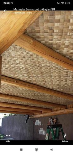 the inside of a house with wood beams and rafters on it's roof