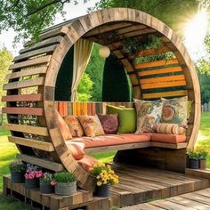 a wooden bench sitting in the middle of a lush green field with lots of flowers