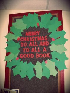 a christmas wreath made out of paper with the words merry christmas to all and to all a good book