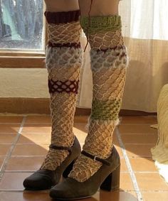 woman's legs in socks and boots with knitted garters on them