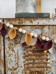 an old rusty refrigerator with some decorations on it