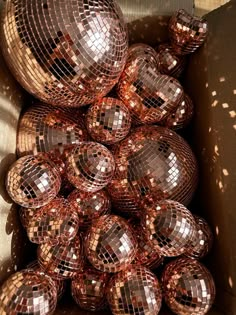 a box filled with lots of shiny disco balls