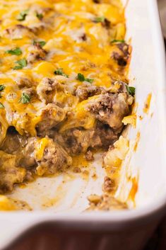 a casserole dish filled with meat and cheese