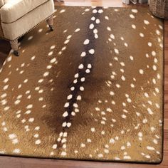 a brown and white rug with spots on it