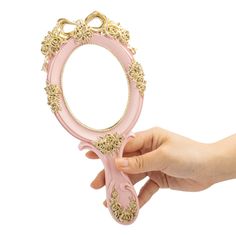 PRICES MAY VARY. Material: The vanity hand-held mirror is made of high quality resin Size: Approx. 10 x 4.5 inches (L x W) Vintage personal makeup mirror is designed with decorative rose pattern and the princess style gives people a sense of elegance and luxury Perfect size makeup mirror is small and easy to carry, and can be placed in a handbag, pocket, purse or cosmetic bag Great as a gift for girls valentine's day, thanksgiving, birthday, etc 1. Eexquisite cute small handheld mirror is great Pink Hand Mirror, Hand Mirror Decorating Ideas, Columbian Wedding, Makeup Table Mirror, Vintage Handheld Mirror, Beauty Maintenance, Princess Mirror, Hand Held Mirror, Vintage Numbers