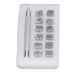 a set of metal stamping tools on a white background