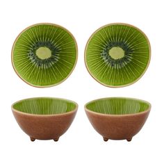 three bowls with green and brown designs on them