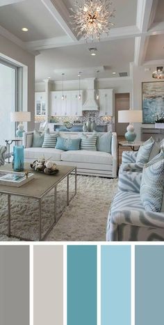 a living room filled with furniture and lots of blue color scheme on the walls,