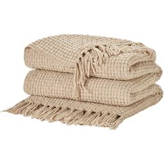 three woven towels stacked on top of each other