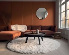 a living room filled with furniture and a round mirror on the wall over a coffee table