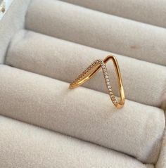 a gold ring with diamonds on it