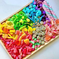 a tray filled with lots of different colored candies