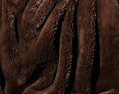 a close up view of the back of a brown jacket