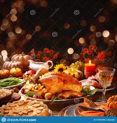 a table full of thanksgiving food and candles