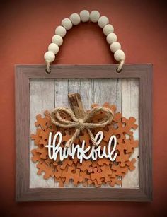 a wooden sign that says,'happy thanksgiving'hanging on a wall