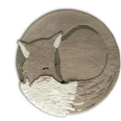 a round rug with an animal on the side in grey and white colors, it is made out of thick wool