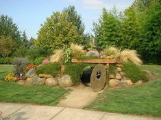 an outdoor garden area with plants and rocks