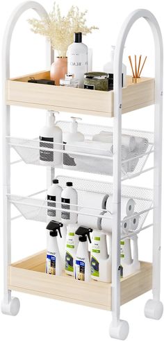 a white shelf with two shelves holding bottles and other bathroom products on top of it