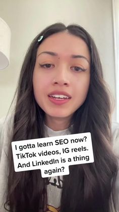 a woman holding up a sign that reads i gota learn seo now? tiktok videos, ig reels, and linkedin is a thing again again again again again again again