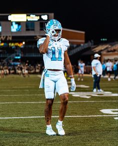 a football player is standing on the field