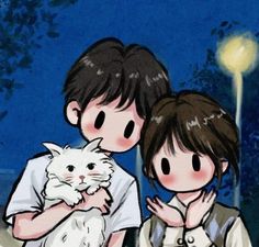 two people are holding a white cat in their arms and looking at the night sky