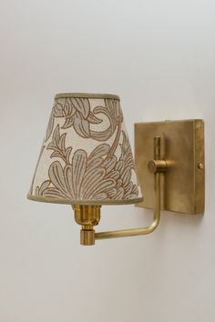 a wall light with a fabric shade on it