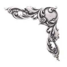 an ornate silver metal object on a white background with clipping to the left side