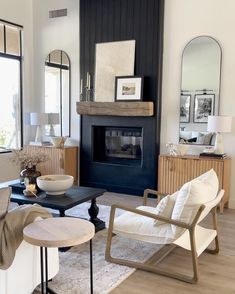 a living room filled with furniture and a fire place