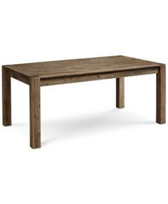 a wooden table sitting on top of a white floor