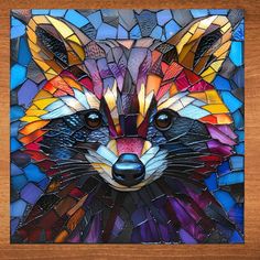 a stained glass mosaic with a raccoon's face in multicolored colors