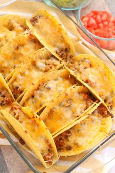 several tortilla shells with meat and cheese in a glass dish