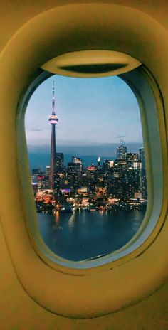 an airplane window looking out at the city