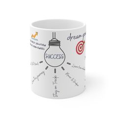 a coffee mug with the words success written on it and an image of a light bulb