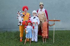 a group of people in costumes posing for a photo